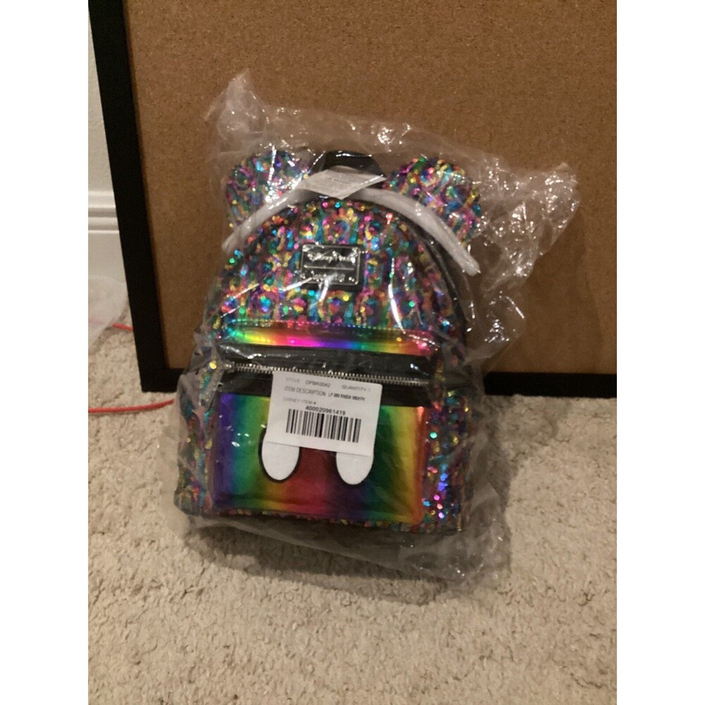 Disney parks Mickey Mouse Rainbow mini backpack By Loungefly New With Tags.